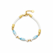 Bracciale azzurro oro sfondo bianco