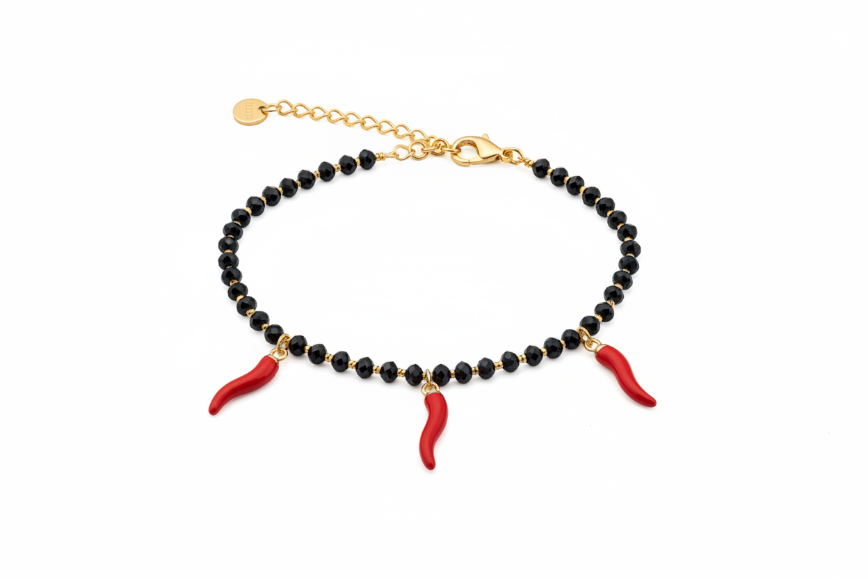 Bracciale oro perline nere 3 cornetti rossi - dettaglio