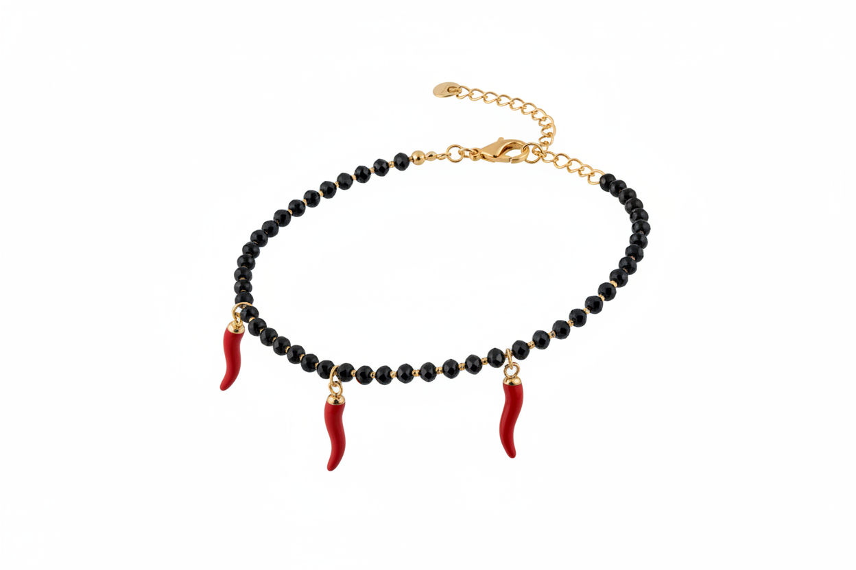 Bracciale oro perline nere 3 cornetti rossi - vista tre quarti